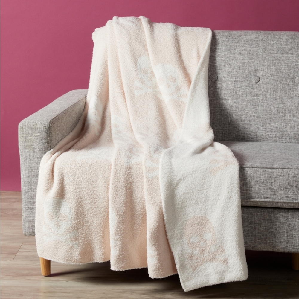 cupcakes & cashmere Pink and White Skull Throw Blanket